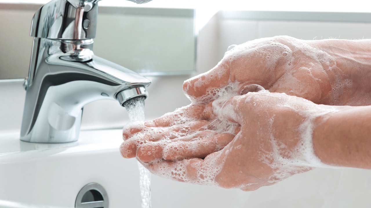 washing hands with warm water and soap