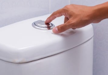 Push button toilet flush sticking