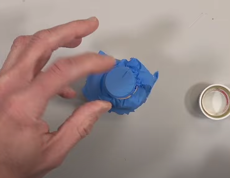 Cover your container with a latex glove