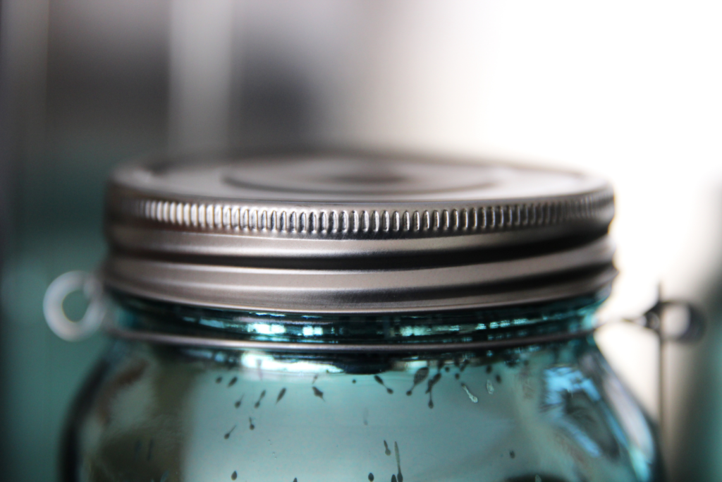 Close up of a mason jar with metal lid