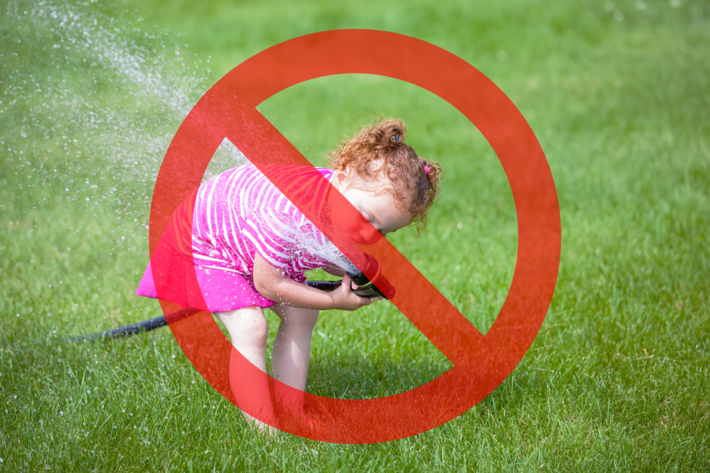 An image of a child drinking water from a hose with a "prohibited" symbol overtop.