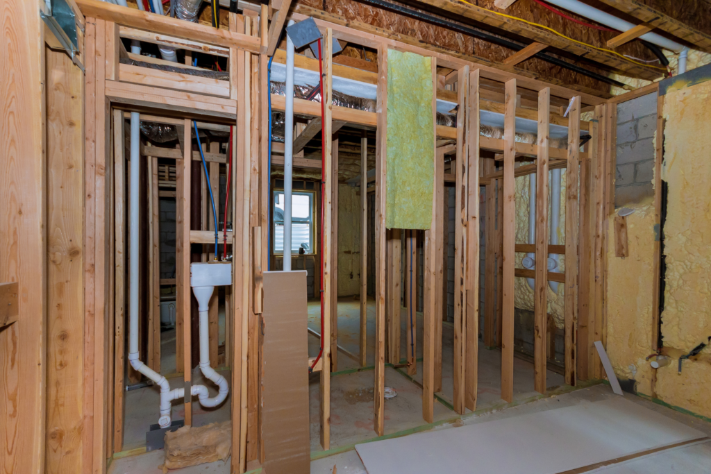 exposed electrical and plumbing in an unfinished basement