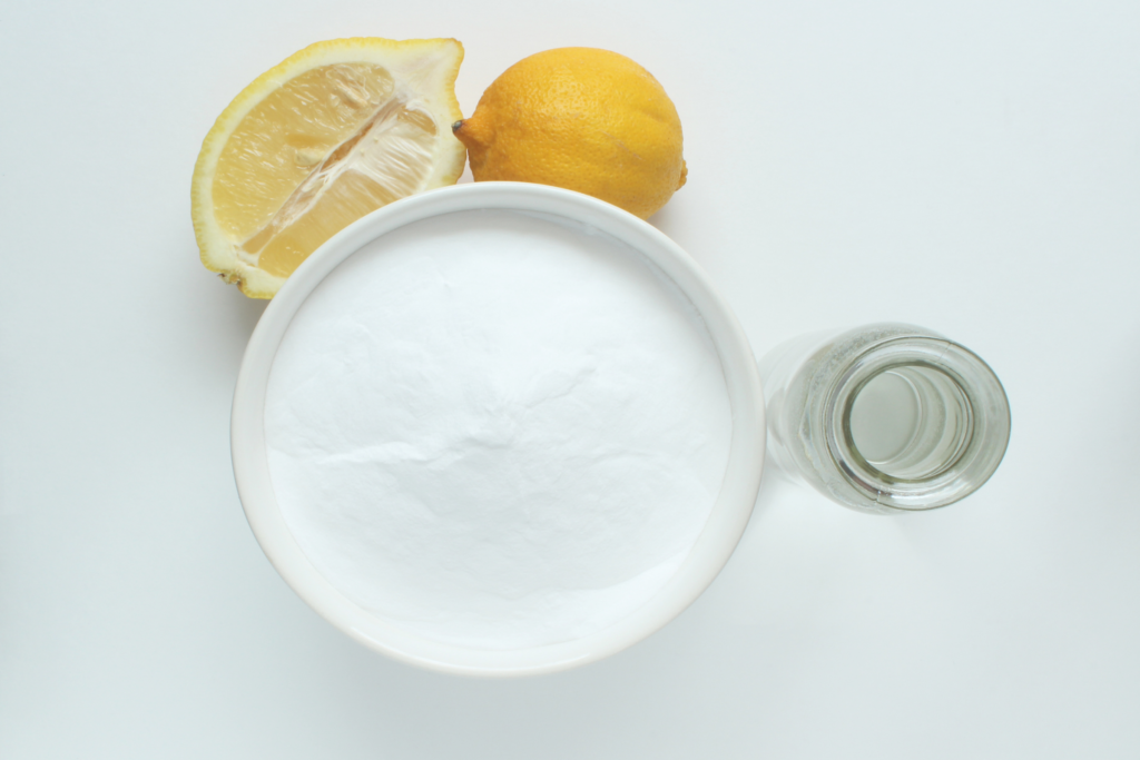 making a cleaning solution with vinegar and lemon
