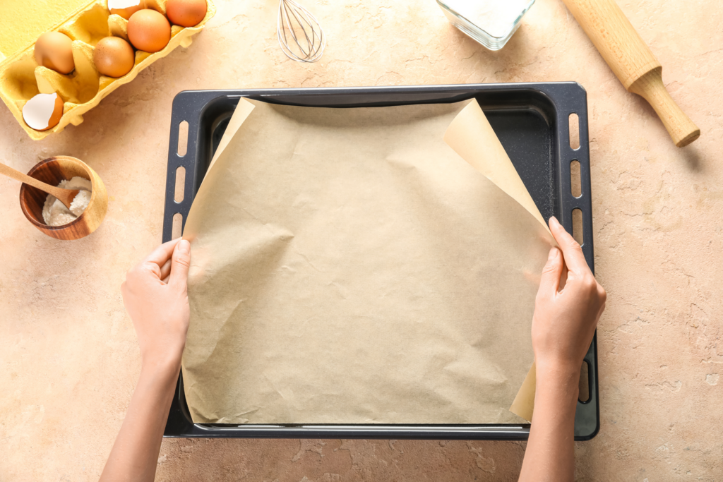 Parchment paper cut to fit dehydrator tray.