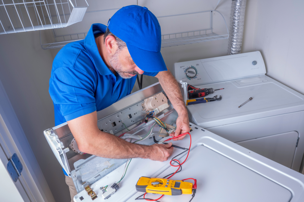 qualified electrician fixing washing machine control board