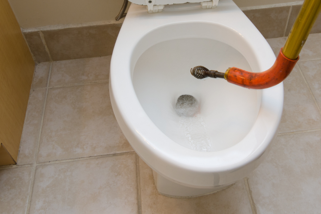 Major clogs - including those caused by tampons - may require a plumber's snake to clear.