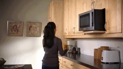 funny gif with lady falling under lots of plastic tupperware